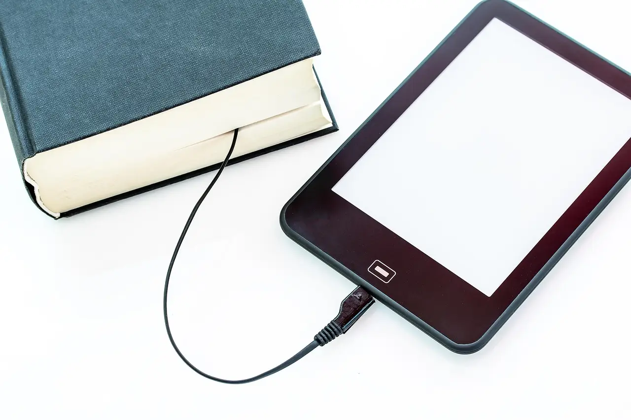 A charging cable plugged into a device on a desk