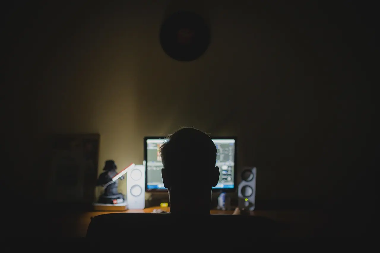 A dark computer monitor on a desk