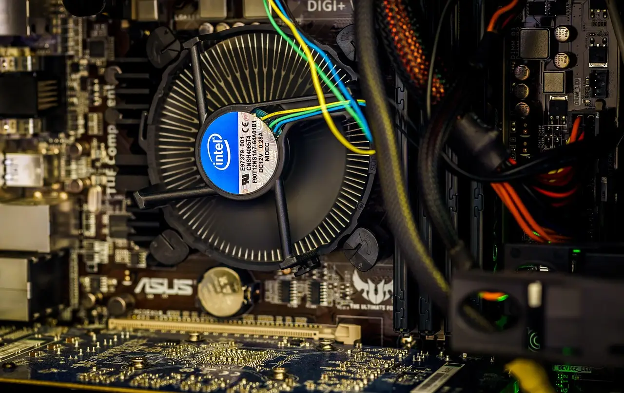 The inside of a desktop PC showing the CPU cooler and case fans