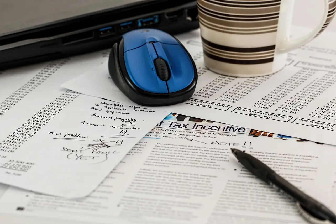 Printed forms and paperwork on a desk