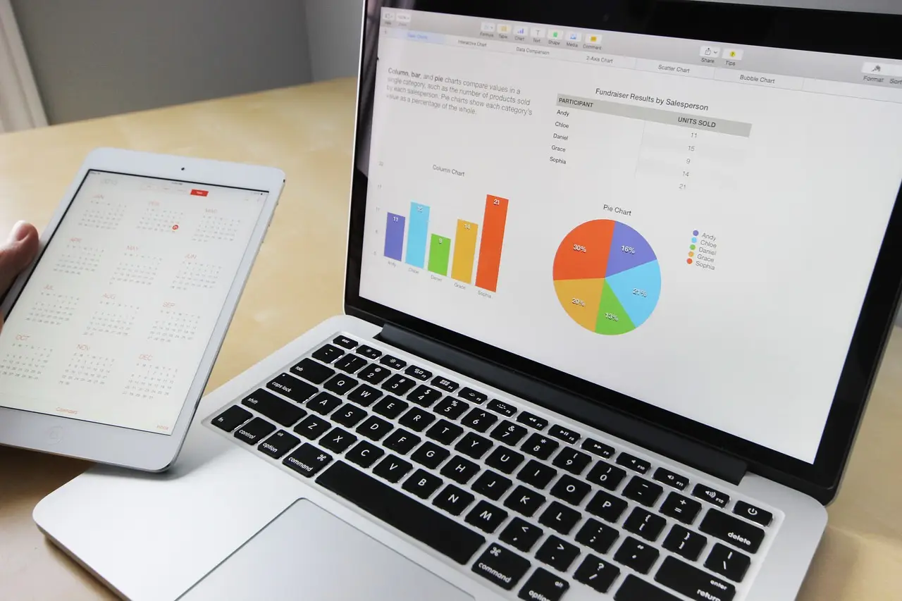 A laptop screen showing a spreadsheet with a row of data highlighted in yellow