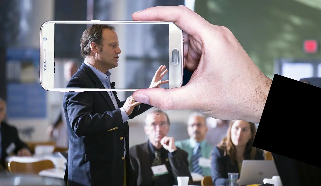 A person giving a presentation being recorded